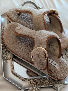Coach Cream Shearling Slide Sandals with Tan Trim and Gold Buckle